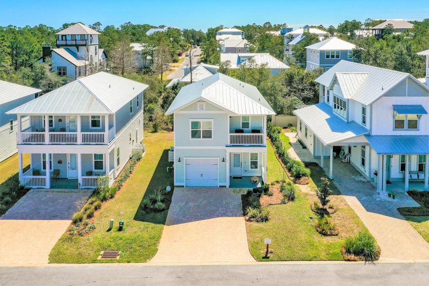 Life is good in Grande Pointe at Inlet Beach! This neighborhood is one of 30a's best kept secrets offering private access to one of the worlds largest and most rare bodies of water known as a coastal dune lake, Lake Powell and bordering the 180 acre protected land of Camp Helen State Park stretching north and south of Highway 98 with miles of hiking and biking trails! The ornate entrance of this Grande neighborhood exudes prestige in keeping with the 30a standard. As you move through the collection of beautiful homes you'll notice the glow of the palms as the sun peeks through and suddenly you find yourself in absolute peace. Along this green belt and steps from the clubhouse and serene private dock, rests 16 Cam Cove! This pristine home is like brand new having never been rented and used