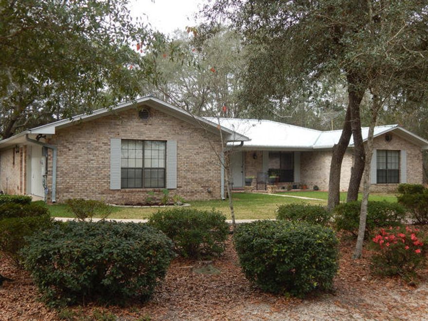 This wonderful piece of paradise can finally be your to own! Located from a mile from I-10 access in Holt, this will make for a quick commute either to the East or West. Only minutes to Eglin AFB, Crestview, Niceville or Pensacola. This 5 acre home site is being offered for the first time and can also be bought with the adjacent 5 acres with a total of 10 acres for an additional $30,000. The home features beautiful sold wood floors in the great room, hallway and formal dining room. There is a wood burning , fireplace insert for extensive and affordable heat in the winter months. There are tiled floors in the kitchen, laundry room, breakfast room and all 3 bathrooms. The country style kitchen comes with solid surface countertops, a reverse osmosis water filtration system.