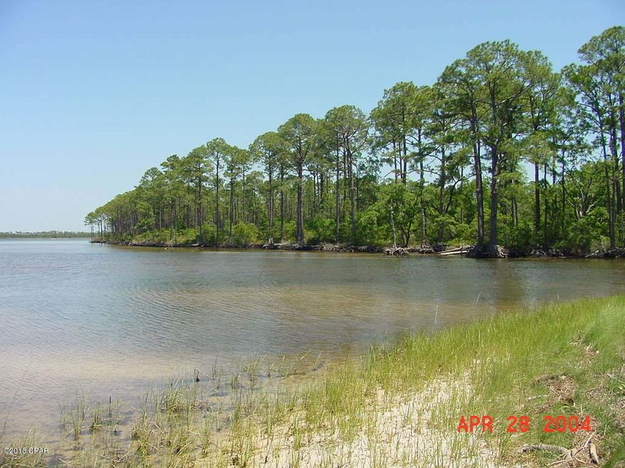 124 Acres on West Bay in Panama City Beach - ''The Oak Grove on West Bay''. Located on the east-side of Colony Club & Trieste neighborhoods & the Holiday Golf Course. Over 1,200 feet on West Bay with expansive views across the Bay. It is comprised of 3 parcels; A=59.9 Acres on West Bay, B=60.1 Acre interior parcel and C=4.4 Acre parcel on West Bay and accessed via Moonlight Bay Drive. The primary access is via the Clara Avenue extension, which is a 100' right of way, now paved close to the south property line. The site has been annexed into the City of Panama City Beach & zoned P.U.D. & Conservation. The highest-and-best use is residential &/or resort. Conceptual site plans, surveys and maps are attached. Call for detailed information & to setup a tour.