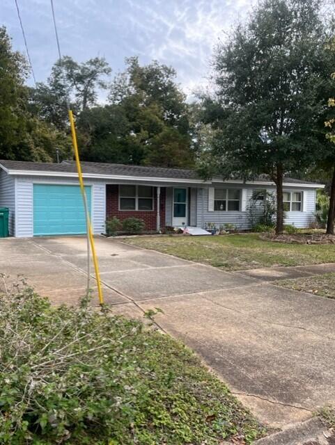 Professional Pics Coming Soon! This Great 4 Bedroom House will make a Wonderful place to call Home. Original Terrazzo under the flooring. Gorgeous! Updated Kitchen with Beautiful Cabinetry. Inside Laundry with room for Storage/Pantry Items or a Fridge. Split Bedrooms with Owners Suite on one side of house and 3 additional bedrooms on the other side. Nice sized Living Room / Dining Room area. HUGE Beautifully Enclosed Florida Room with Heating and Cooling - NOT Included in the Square Footage! Overlooks the Fully Fenced yard that backs up to the City of Mary Esther Park. The lush Vegetation from the park keeps this a Private Oasis with Pond and Waterfall. Out Building with Electric for she shed/man cave! One Car Garage with auto-opener. See It Today!Buyer to verify all pertinent info.