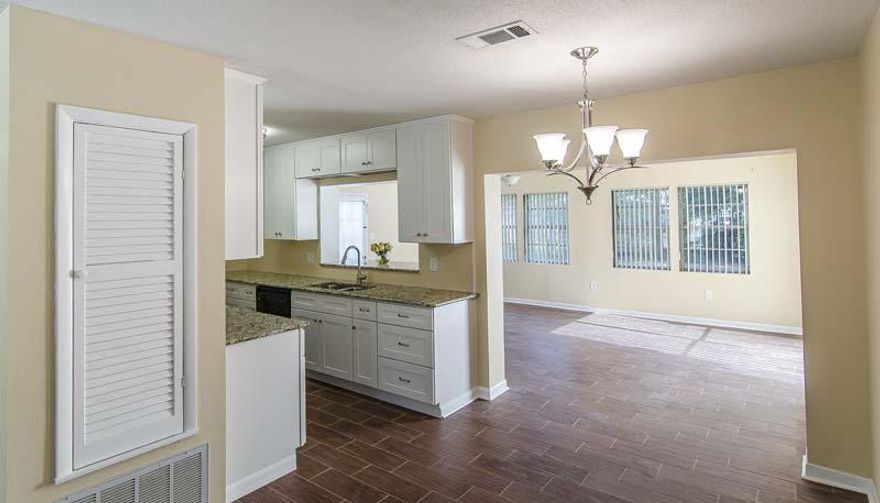 Home has been appraised and is priced to sell! Gorgeous home with beach cottage charm! Spacious open floor plan. 3 separate living areas. Den has stunning wood ceiling, fire place and built in book shelves. Walk in shower in Master bath. Kitchen with granite counter tops and Gas lines. Indoor laundry room. Fenced/gated yard. You Don't want to miss this!