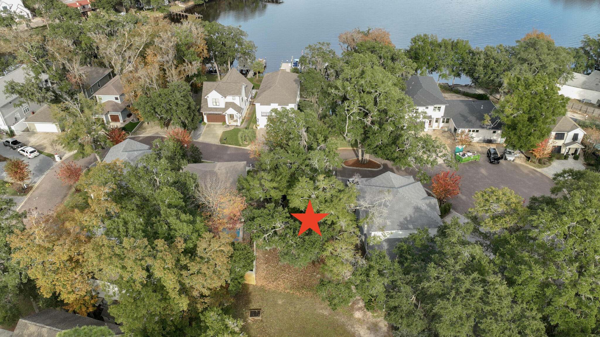 Waterview Lot in Sacred Oaks! Enjoy a tranquil setting with massive live oak trees, underground utilities, brick paver streets, and a community dock on Mack Bayou. There are no short term rentals allowed in Sacred Oaks and this lot backs up to a green space for additional privacy. The neighborhood is convenient to some of the areas best shopping and dining in nearby Sandestin Resort and Grand Blvd. There are many public beach accesses within a few miles. Tap fees are paid on this property.