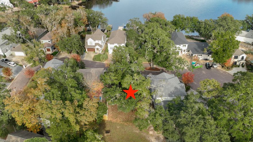 Waterview Lot in Sacred Oaks!  Enjoy a tranquil setting with massive live oak trees, underground utilities, brick paver streets, and a community dock on Mack Bayou. There are no short term rentals allowed in Sacred Oaks and this lot backs up to a green space for additional privacy.  The neighborhood is convenient to some of the areas best shopping and dining in nearby Sandestin Resort and Grand Blvd.  There are many public beach accesses within a few miles.  Tap fees are paid on this property.