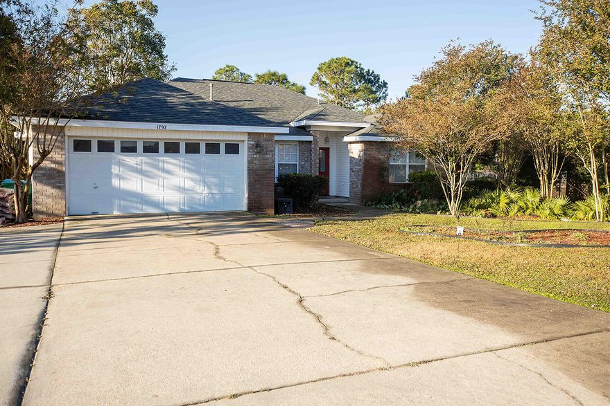 A great home that's priced right! In one of the most favorite waterfront subdivisions in Navarre with sidewalks, beach access, park, dock, and picnic areas. The Great room has a raised ceiling and flows to the double doors going to your back yard with a raised deck and adjacent to Conservation area. The kitchen has all stainless steel appliances and plenty of cabinets with eat in kitchen. Large Master Bedroom has a tray ceiling with double doors leading out to patio. Master Bath has huge dual vanity, garden tub, large walk in closet and separate commode closet. The driveway has been extended to handle a third car or RV/Boat on side of house. A whole house generator permanently wired into the homes electric circuit so you never have to worry about losing power in a storm or other situation