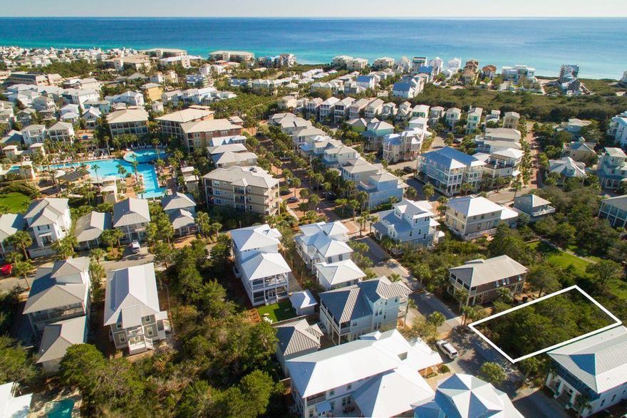 This vacant lot in Seacrest Beach presents the perfect opportunity to build your own beach house, exactly the way you want. Clear just enough trees and leave the rest for shade, nature and privacy. It's time for your design, your bungalow or cottage, your own private beach retreat with your favorite colors and materials. You can be the creative mind behind the dream. Once in your brand new beach haven, you have 24-hour security and cool walking trails throughout the neighborhood.
Strolling to the pristine white sands on the emerald green Gulf of Mexico shoreline takes less than 10 minutes, but spring to fall, hop on the tram and let them transport you to the beach. The land is adjacent to a pocket park, a little spot of respite, and a gorgeous 12,000-square-foot resort-style swimming pool beckons anyone who loves their toes in the water on a hot day. Proximity to Rosemary and Alys beaches and lots of fun shops and eateries are like frosting on the cake. With several wonderful architects and builders in the region, now is the time to move your beach home dream from the napkin sketch to this attractively priced plot of land.