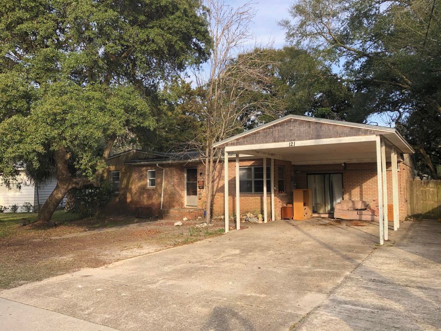 Flipper's dream in Fort Walton Beach! 3/2, needs full rehab. Hardwood floors with large shaded lot and brick fireplace in spacious backyard. Perfect for cookouts and family gatherings. This home is located in the heart of Fort Walton Beach, close to everything. Uptown Station and Burner Middle School are just minutes away. One of the most desirable neighborhoods in Fort Walton Beach.Cash offers only.Room sizes are estimated.