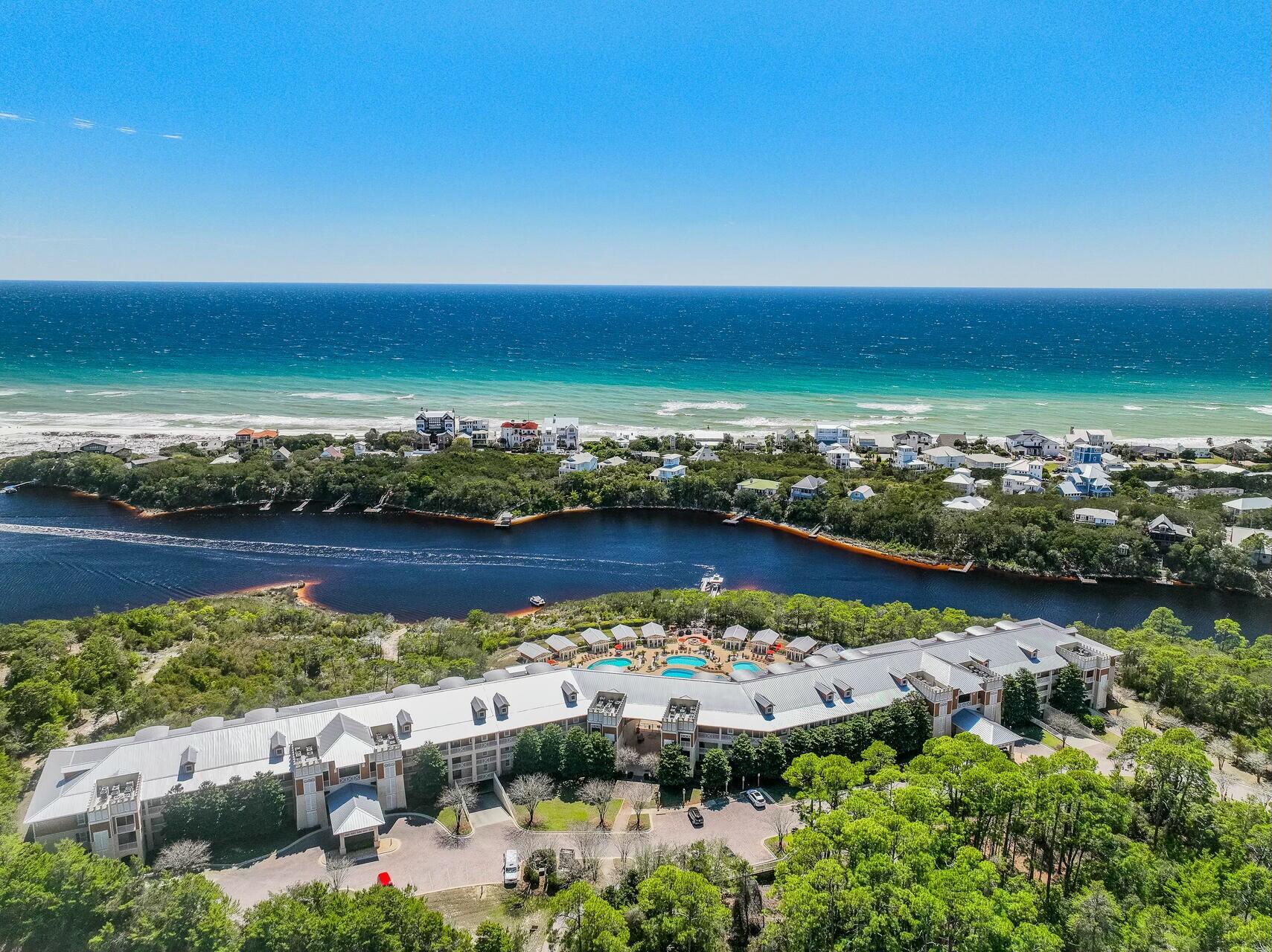 Tucked away in the exclusive gated community of Sanctuary at Redfish, this stunning condo is a hidden gem, priced below appraised value. Surrounded by nature and overlooking a rare coastal dune lake with glimpses of the Gulf, it's the perfect place to unwind. The freshly painted open-concept layout boasts a cozy gas fireplace and a spacious balcony--ideal for sipping your morning coffee or catching a breathtaking sunset. Resort-style amenities make every day feel like vacation, with multiple pools (one heated), hot tubs, a grilling area, garage parking, storage cages, a fire pit, lush terraces, and a fitness center. Plus, with private boat access, you can paddle out on Big Redfish Lake and explore one of the most serene coastal lakes in the world. Whether you're looking for relaxation or adventure, this is 30A living at its best.