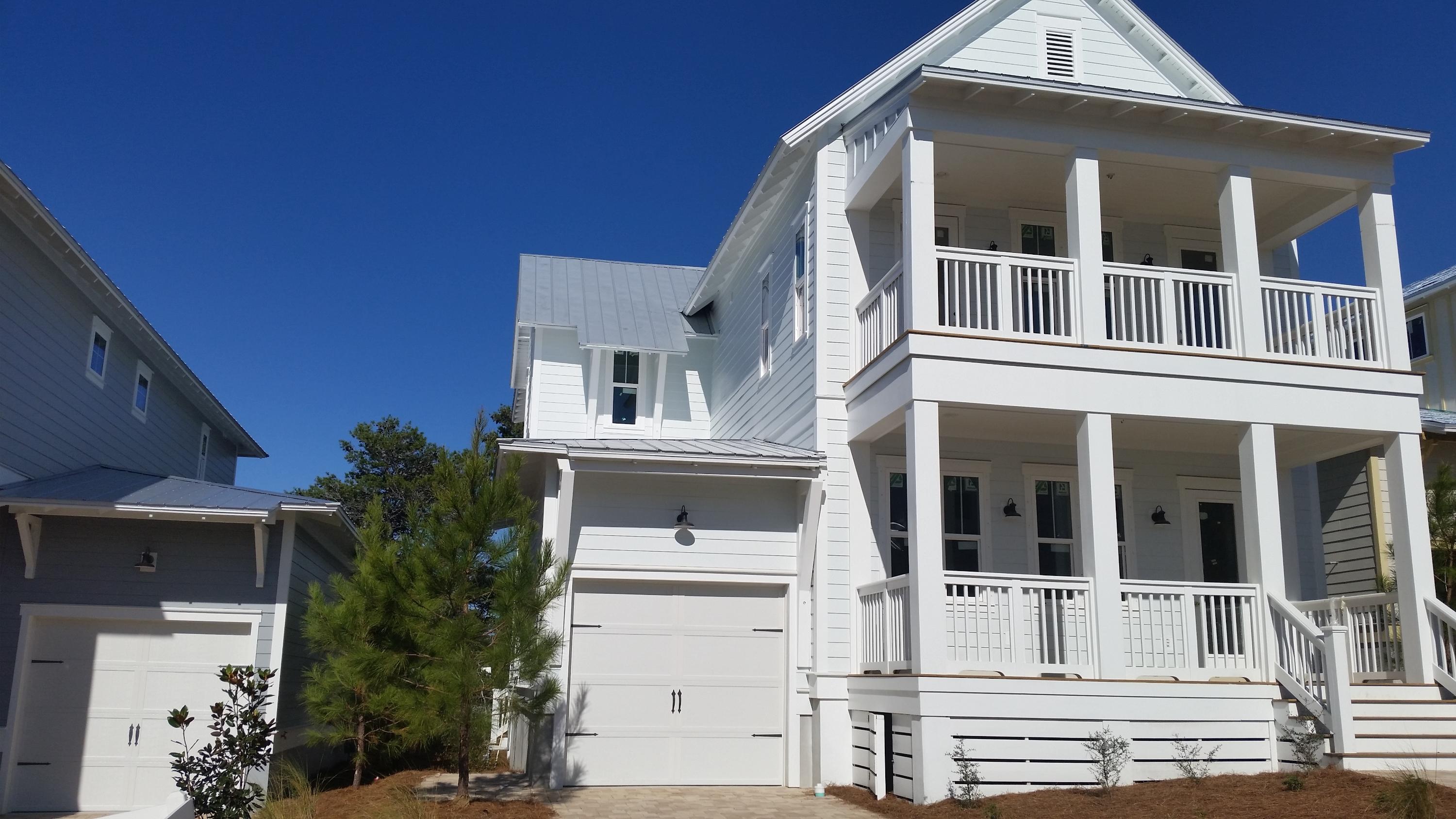 The Boardwalk plan under construction on Lot 97 is one of the most popular plans currently under construction in Highland Parks. This home has 10 ft. soaring ceilings. Photos are of this plan with 12 ft.ceilings (our Sienna plan). Please ask agent for differences in 10 ft. and 12 ft. Same footprint, just difference in ceiling height. Beautiful beach home with TWO MASTER SUITES, 4 1/2 BATHS, and a MEDIA ROOM. This home would make a great full-time, vacation home. Stainless steel appliances, granite countertops, tile in baths and laundry, wood floors in main living areas and stairs. Tankless water heater, and Gavalum Metal Roof. This home backs up to greenspace. Pictures may be of similar, but not necessarily of subject property, including exterior and interior colors.