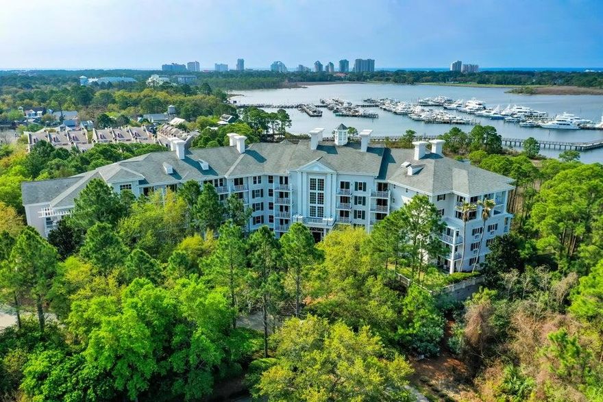 Beautifully renovated 1-bedroom corner unit with large wraparound balcony overseeing the Baytowne pedestrian walkway as well as beautiful bay views.  This turnkey vacation getaway features updated floors, quartz countertops, a fully renovated kitchen and bath (2021). No carpet. Updated AC and water heater (2021), plus a brand-new refrigerator and dishwasher (2024), make it low-maintenance and move-in ready. Great for personal use or as a vacation rental with strong income potential!  Lasata is in a prime location within Baytowne Wharf, offering easy access to dining, shopping, and entertainment. Owners enjoy access to the resort-style lagoon pool, hot tubs, and fitness center at the Grand Sandestin, along with exclusive use of the Solstice Club. As an introduction to the Sandestin lifestyle, we invite our new owners to explore amenities that make Sandestin special. The listing brokerage and seller(s) are presenting the buyer(s) of this property with (2) 90-minute rounds of Tennis court time, a golf foursome at one of our three championship courses, and a round of golf for up to four (4) players at the unrivaled Burnt Pine Golf Club. Sandestin Golf and Beach Resort features more than seven miles of beaches and pristine bay front, four championship golf courses, 15 world-class tennis courts, a 226-slip marina, a fitness center, spa and celebrity chef dining. Shop, dine and play at the charming pedestrian village, The Village of Baytowne Wharf and more. Inside the gates of the resort, residents enjoy a balanced lifestyle of high-class living, spanning the 2,400 acres from the beach to the bay. Everything within the gates of the resort is accessible by golf cart or bicycle. The entire resort is interconnected by miles of pedestrian, bike and golf cart paths that weave through groves of live oaks, meandering past natural lagoons, fountains, man-made lakes, and meticulously landscaped fairways.