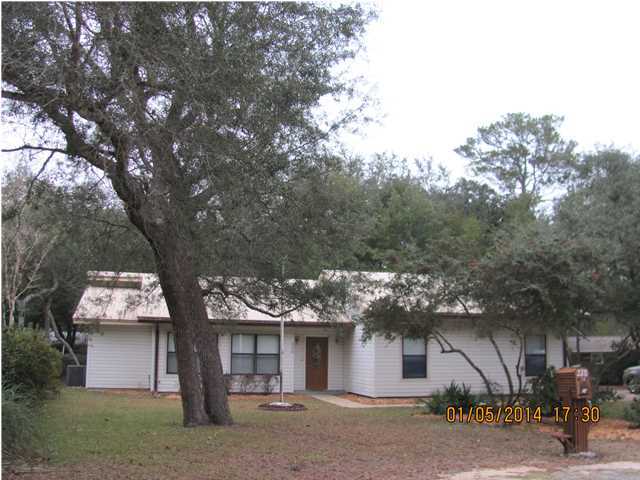 Absolutely beautiful upscaled neighborhood is tucked back into this quaint area with gorgeous trees and wonderful waterviews throughout the surroundings. This well maintained home is just over a third of an acre, has great areas for gardens and plenty of room for children to play and explore nature. Only 5 - 7 minutes to Eglin's East gate. The side entry garage (25x21) has plenty of decked attic space for storage. There are two exterior sheds which would be great for storage. All exterior walls in the house have R-30 insulation for energy efficiency. Siding is vinyl and the roof is metal. Tile foyer, new wood flooring in the dining area and hallways, vaulted great room ceiling with fireplace has plenty of space for any size furniture and there's the option to divide the large great