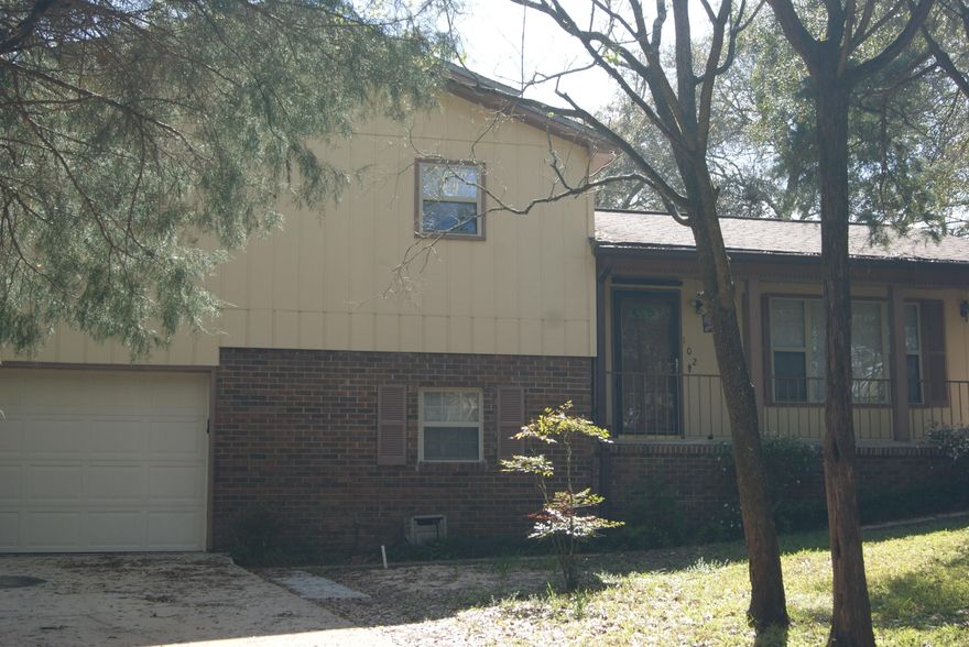 Must see this well maintained 4 BR home with Niceville schools for only $235K. Nestled in a quiet location on a quiet cul-de-sac, this home has hurricane protection for all windows/doors. Split level home has updated kitchen with eat-in area as well as living room on main level. Upstairs there are three bedrooms and one and a half baths. Downstairs there is one bedroom and one full bath as well as the 1 car garage with storage shelves, washer dryer hook ups and storage area. Large backyard with 2 sheds--one used as a garden shed and the other as a storage shed. Enjoy quiet evenings in the approx 100 sq ft screened porch. All information deemed reliable. Buyer to verify anything deemed important to include room dimensions, sq/ft, etc.