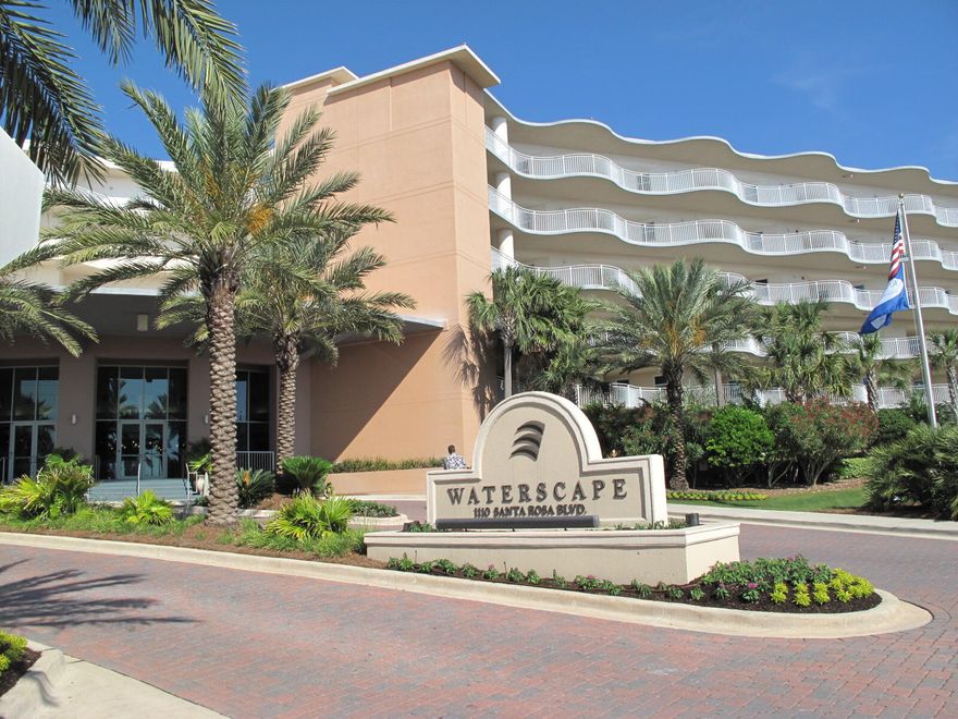 WATERSCAPE RESORT is Okaloosa Island's top family resort, and this unit is located in the eastside building. This unit conveys fully furnished and rental ready. The kitchen is equipped with stainless steel appliances, granite counter tops, and solid wood cabinetry. A new stackable washer/dryer is located in a storage space in the kitchen.  Both bedrooms have spacious ensuite bathrooms with garden tubs, double vanities, and separate showers. Tall glass doors open to the balcony.  A bunkroom provides a cozy and private spot for the kids.  Amenities include: 490 feet of beachfront, two hot tubs, fitness center, gas grills, large conference room, game room, various pool features, tropical pavilion, covered parking and more!  Buy a piece of paradise!