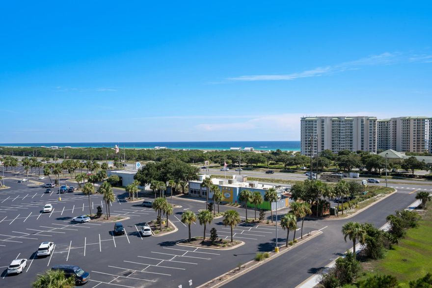 This unit has a good unincumbered gulf view to the east. Units at this price usually do not. Fresh interior paint & New kitchen appliances. Unit 1712 is a 7th floor unit in the east building. Welcome to The Palms of Destin! Where luxury living meets convenience and comfort. This 7th floor condo offers breathtaking bay views from its private balcony, providing the perfect backdrop for relaxation and serenity. With 2 bedrooms and 2 full bathrooms, this spacious unit boasts a generous 970 square feet of living space perfect for a second home or vacation rental! The open floor plan allows for seamless flow between the living room, dining area, and kitchen, creating an inviting atmosphere for entertaining guests or enjoying quiet evenings at home. Dive into the expansive 11,000 square foot lagoon pool with its cascading waterfall and rejuvenating spa.  Let your little ones splash around in the children's pool or enjoy the playground nearby. Stay active with a game of tennis or basketball on the lighted courts, or maintain your fitness routine in the first-class fitness center. For added convenience, a seasonal shuttle service is available to take you directly to the beach. Located just a short walk away from pristine beaches and delectable restaurants, this condo is perfectly situated for those who crave both relaxation and adventure. Covered protected parking ensures that your vehicle stays safe and secure. One of the standout features of this property is that all utilities are included in the association fees, providing peace of mind and making budgeting a breeze. Don't miss out on this incredible opportunity to own a piece of paradise at The Palms of Destin. Contact us today to schedule a viewing and experience the epitome of coastal living.