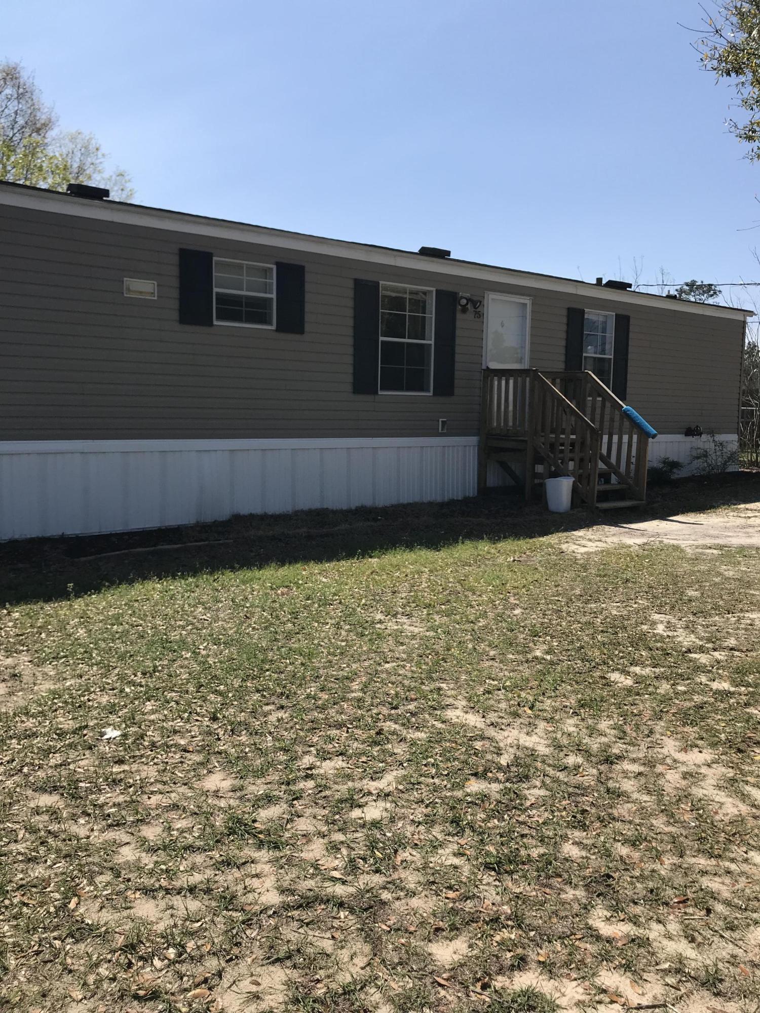 2012 3BR/2BA mobile home. Nice open living room with a beakfast bar and kitchen and breakfast room. Two bedrooms and bath at one end and the master bedroom and master bath are at the other end. Before you get to the master there is a spacious mud room with a built in bench for taking off your boots and shoes, plus there's a built in desk on the other wall, And beyond that is a small room for the washer and dryer. All this sits on .99 of an acre.