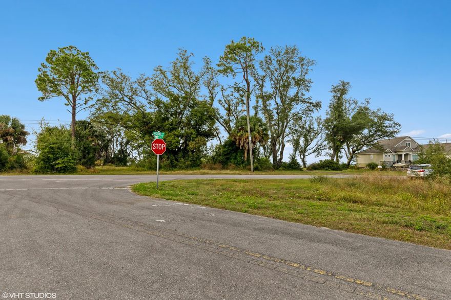 FLORIDA WATERFRONT!  Over 1/2 acre on east shore of St Andrew Bay, gulf access. GREAT LOCATION near colleges, shop/dine & sugar-white beaches. Mature live oaks & palms w/ space for house. Enjoy sunsets across 131' of beach. Peaceful  neighborhood. Public boat ramp around corner. Relax, explore, ski, fish!