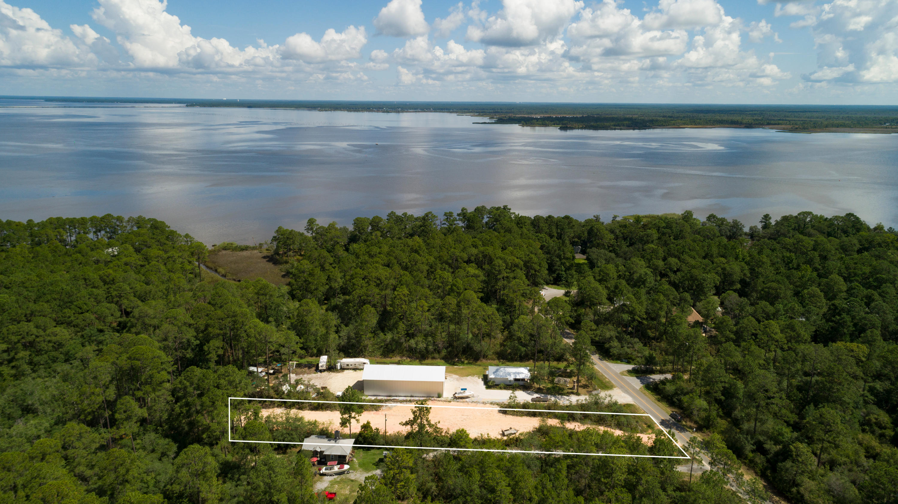Build your dream home on almost an acre cleared Lot near the Choctawhatchee Bay, where there are no restrictions no build out time nor HOA.Why would you not want to live here? Enjoying peace and quiet from all the crowds, yet just a quick 10 minute drive down to the Grayton Beach Public Access and Red Bar! Most all of the owners in this Point Washington area enjoy their large lots, almost an acre, walking around the Shallows, watching birds of all types, riding bikes with families and visiting the Pt. Washington State Park. For boating and fishing, you would drive to the end of Hwy. 395 and launch off free and within a few minutes from this homesite. Enjoy feeling like you live in the Country, yet close to everything Old Seagrove and Scenic 30-A have to offer!