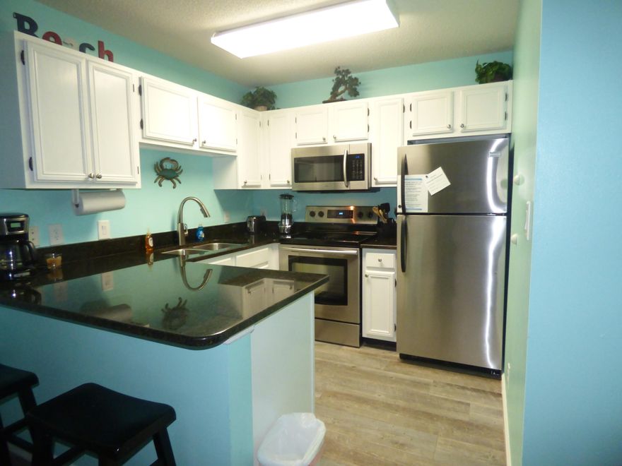 Rental Powerhouse at 35,648.00 a year. What fabulous gulf views from this rarely available top floor corner unit. Relax and enjoy beautiful sunsets from this beachy renovated unit that includes new elongated tile floors that look like wood, stainless steel appliances, granite counter tops, custom tiled shower, new vanity, new toilet, new fans, built-in bunk beds, new furniture,new paint, and brand new AC unit just installed July 2, 2017. This unit has 40,000 dollars in improvements. Call for appointment.