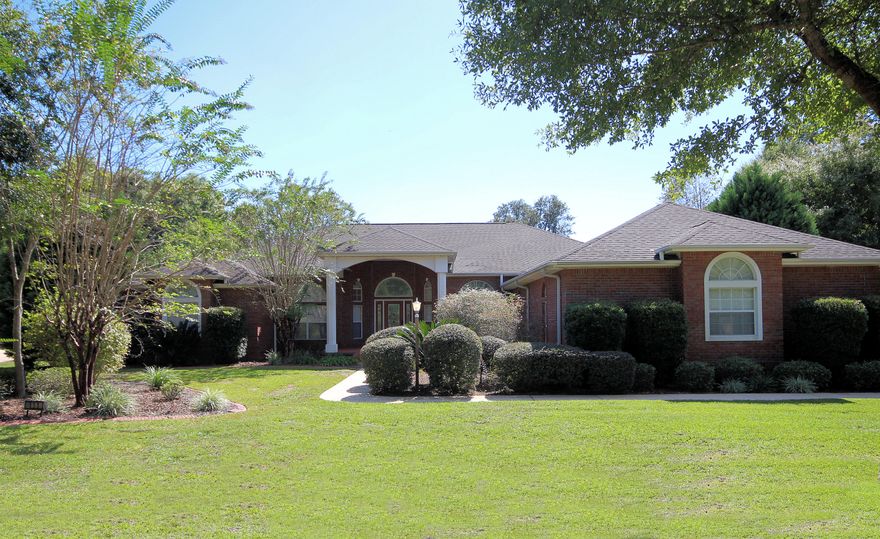 Gorgeous custom home in Rocky Bayou Estates. Enter through the beautiful front entrance that lead directly to the elegant living room with views that extend out to the glistening pool and lush landscaping. The open floor plan features arched openings, raised ceilings with crown molding, gorgeous oversized tile throughout entire home, upgraded blinds, and fireplace, plus way more. You will be amazed at all the special features throughout the entire home. To the left of the living room is the spacious office and Master Suite. The office area has gorgeous hardwood floors and French doors for privacy. Onceyou enter into the spacious master you will be swept away by all the beauty. High ceilings with gorgeous crown molding, tile floors, walk-in shower and jetted tub, his and hers separate
