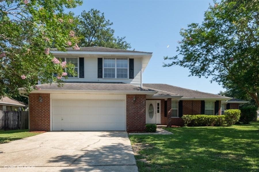 Well maintained, freshly painted, two story home with 2.5 bath and built-in 1996. It has 3 bedrooms upstairs and 1 master bedroom downstairs, although one of the bedrooms upstairs is large enough to be a master bedroom as well if desired. All bedrooms have large walk-in closets. Entire home has newer carpet (2019). Large front yard set on a curve, privacy fence in the backyard along with a covered patio. A large living room that is open to the dining room and kitchen. There is a storm shelter that has an attached Iron spiral staircase next to the main living room for quick easy access with plenty of electrical outlets (4) if ever needed. Newer Whisper-quiet Genie garage door opener installed with two remotes (2019).