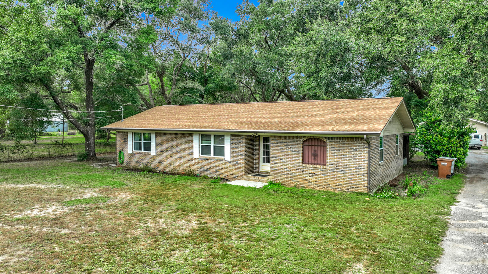 Charming 3-Bed, 2-Bath Home on .76 Acres with Abundant Amenities! Welcome to this beautifully maintained 3-bedroom, 2-bath home nestled on a spacious .76-acre lot. Enjoy the comfort and convenience of modern living with an array of standout features. The kitchen is a chef's dream, equipped with stainless steel appliances and granite countertops. Relax in the living room with the built-in entertainment center, perfect for cozy movie nights. All 3 bedrooms are good sized with the master bath having a tub shower combo and separate shower as well. Step outside to the expansive covered patio, ideal for outdoor dining and entertaining. The partially fenced yard is dotted with gorgeous trees, offering shade and a serene environment. Cool off in the brand-new above-ground pool, or make use of the camper hookups for visiting guests. The property also boasts a long driveway, a two-car carport, and a massive detached garage for your vehicles, toys, and tools, plenty of space for all your storage needs. Recent updates include a new roof (2022), New Septic (2022), HVAC system (2020), and a brand-new water heater (2024), Leaf Filter Gutters, ensuring peace of mind for years to come. This home is a rare find with its blend of modern upgrades, ample outdoor space, and convenience. Don't miss out, schedule a showing today!