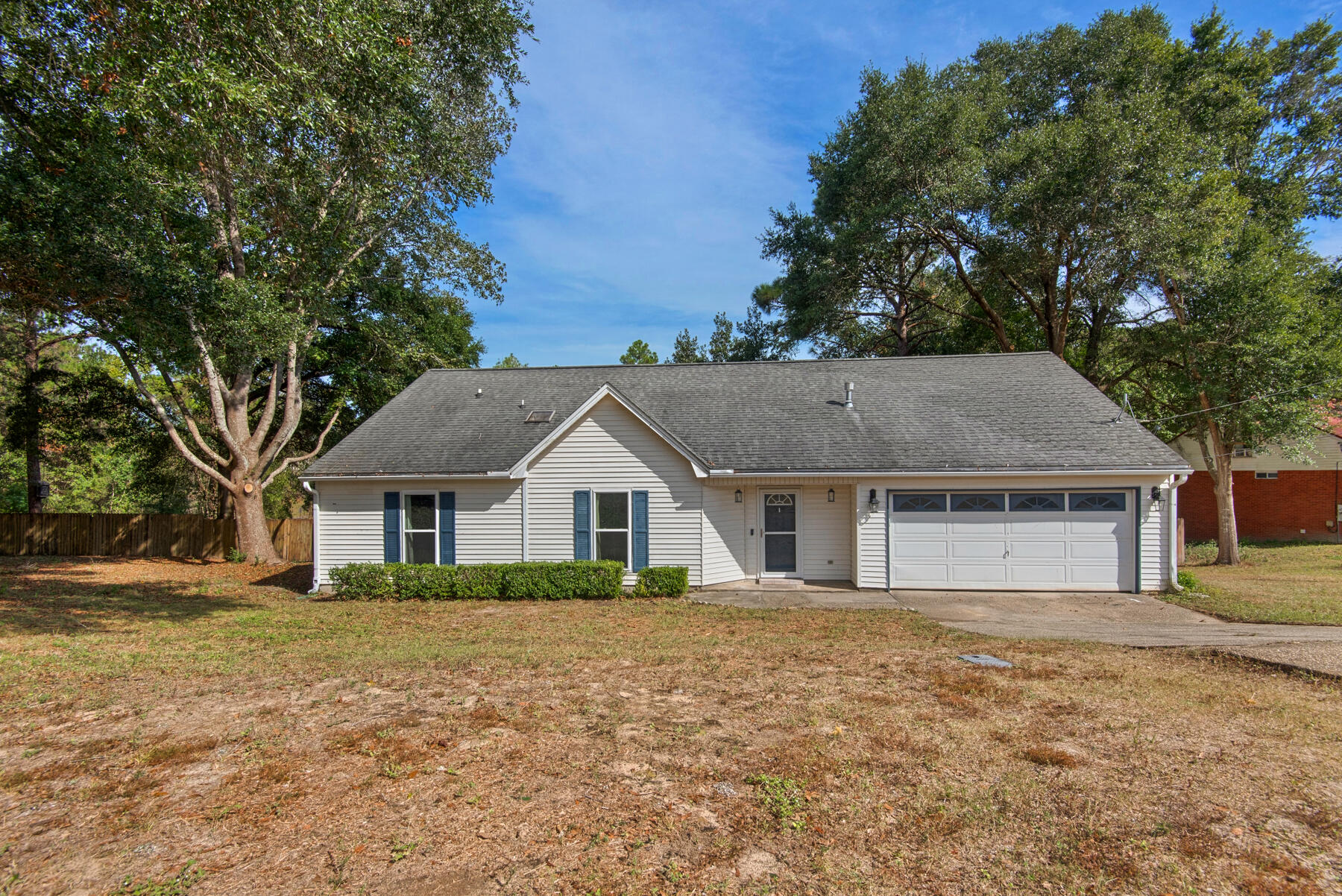 Enjoy evenings and mornings on your porch swing, overlooking your ''backyard pond'' - perfect for fishing or simply relaxing. Located in South Crestview, with easy access to I-10. Downstairs you'll find an oversized living room with vaulted ceilings, gas fireplace, and glass doors leading out to the deck. Large 4th bedroom located upstairs - could easily be used as a den, office, playroom, etc. Upgrades include New AC (2021), New hot water heater (2022). Seller agrees to put on a new roof with an accepted offer. Professional home inspection completed Oct 2022 and all items repaired.