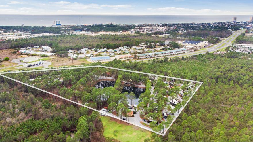 PRIME LOCATION! Pineglen Motorcoach & RV Park boasts 13.8 acres with close to 6 acres of commercial development opportunity along the 830ft of frontage on Panama City Beach Pkwy that is slated to expand from four to six lanes per FL DOT. Positioned along the Beaches corridor that Panama City Beach is known for, this opportunity won't last! Just over 1 mile to the World's Most Beautiful Beaches and minutes from Pier Park offering the best shopping, entertainment and family fun as well as Frank Brown Park and Aquatic Center. Panama City Beach Sports Complex is 2.8 miles east and new large developments are going up all over the neighboring areas. All info is deemed accurate but not guaranteed. Buyer is personally responsible for verifying all information. for verifying all information prior to close.