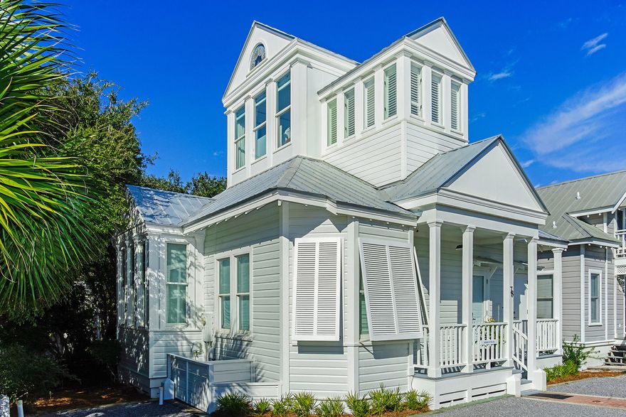 Located along 30A in Seaside, FL, this iconic 2-bedroom + Loft, 2 bath beach cottage offers 1,192 square feet on the corner of 30A  in prime position in Rosewalk, mere steps from the Tupelo Pavilion private beach access. Completely remodeled in 2019, with modern features, this white beach cottage offers quintessential original charm with soaring vaulted ceilings and windows. Originally designed by Robert Orr and Melanie Taylor.Upon entrance to the cottage, the warmth of the hardwood floors envelops you against the coolness of the white walls and high ceilings.