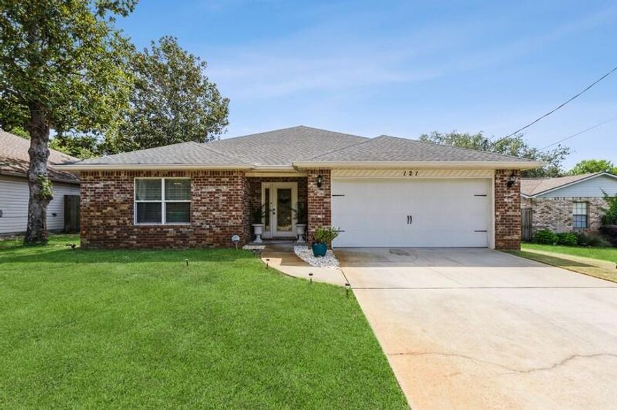 Contemporary 3BR/2BA home just 3 minutes to the Hurlburt AFB gate on Hwy 98! Built in 2016 with 1,630 sq ft, this home features cherry plank tile throughout (carpet in bedrooms), trey ceilings with crown molding, and recessed lighting in the living room and master suite. The kitchen offers stainless steel appliances, granite counters, and Birchwood soft-close cabinets. Granite in both bathrooms. Located on a quiet no-outlet street next to the Eglin Reservation, no manufactured homes on the street. Only two owners. Shopping and daily needs just minutes away. Stylish, well-kept, and ideally located for military or anyone seeking comfort and convenience!
