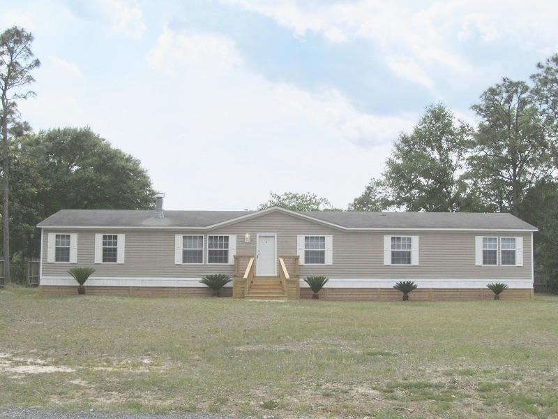 WOW. 4 BEDROOM WITH A GAME ROOM & WET BAR!!! Hurry this ''Like New'' manufactured home is a must see. Fireplace, open kitchen dining, split floor plan and a family/game room that is 14x28 and includes a wet bar, custom cabinets and custom lighting for a pool table if so desired. Corner lot. Move in ready!!! Excellent condition.