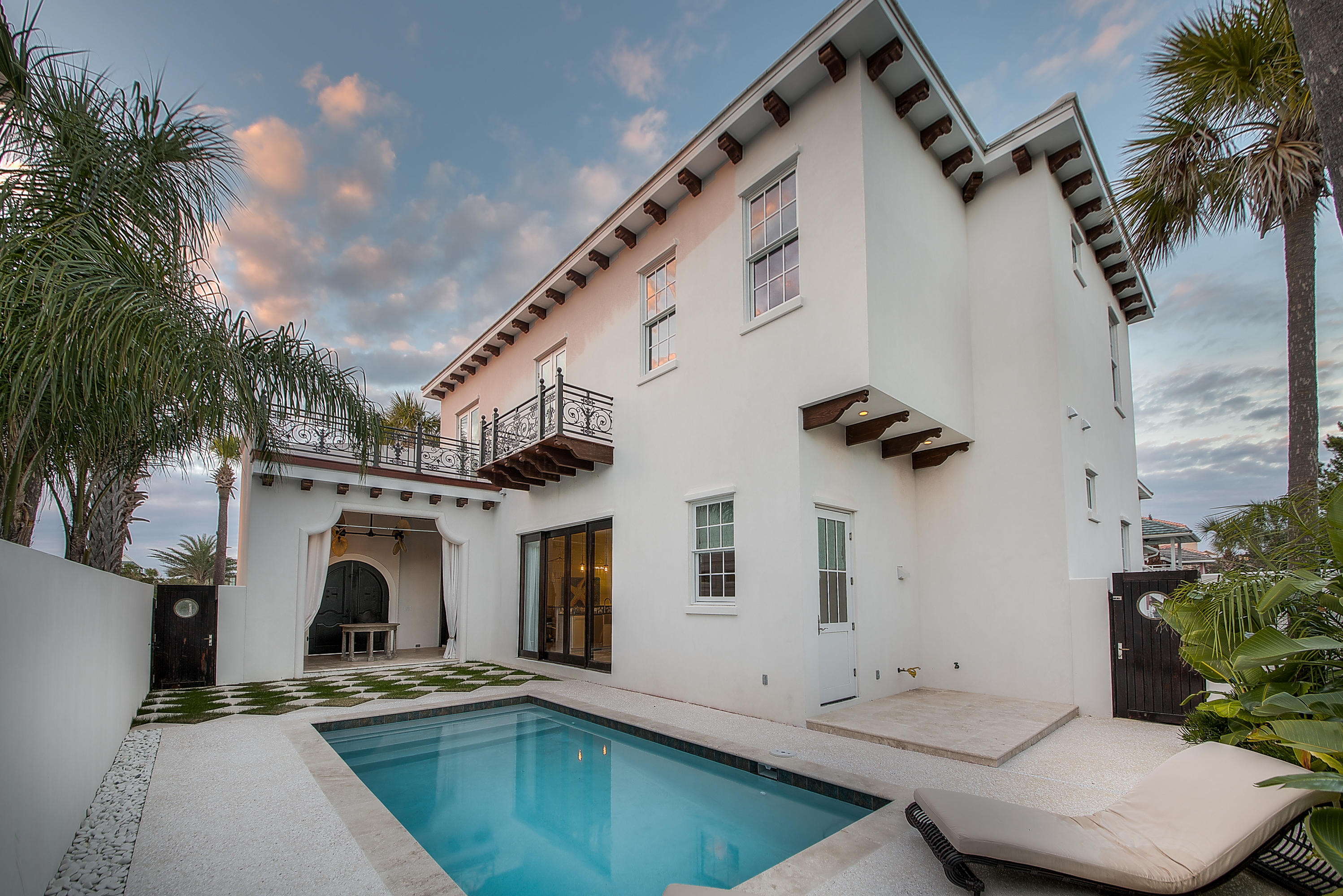 Location is everything. Built in 2016 this home is located south of 30A, in the small gated community of Longue Vue. Just steps from the beach, this four bedroom, four and a half bath home is in pristine condition, offering the latest in design and finish. With plenty of room for the entire family, there are two master suites to choose from-one on the first floor and one on the second floor. The large outdoor courtyard has a heated pool and is wonderful space for entertaining. Enjoy sunset views from the upstairs master balcony. You will never want to leave.