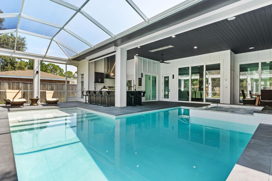 MODERN SMART HOME! Exquisite Luxury NEW Smart Home in Sandestin - Fully Furnished and Short-term rentals allowed. 2024-$124,000K w/3 months owner use. $85k on books now! Projections of $175,000K. Elevated living in this exceptional residence in the heart of Sandestin Resort. This distinctive home is set within a single HOA community, offering 4,200 square feet of thoughtfully designed indoor-outdoor living space, including an expansive lanai and a detached guest suite. Step inside to find a light-filled, open-concept layout that blends refined finishes with advanced technology. The residence is equipped with voice-activated smart systems for climate, audio/visual, window treatments, offering a lifestyle of convenience and comfort. Words cannot describe how exceptional this home looks and feels and all it offers the homeowner and family. The gourmet kitchen showcases a gas stove and oversized kitchen peninsula with seating for ten. Beautiful hand-crafted cabinetry, and a spacious walk-in butler's pantry, ideal for hosting and everyday functionality. Off to the side a nice wine bar for your favorite cocktail. 

Inside, nearly 3,000 SF of interior space is accentuated by striking designer chandeliers, including a remarkable Chihuly-style glass installation in the foyer, setting a sophisticated tone upon entry.

A climate-controlled garage (814 SF) accommodates two vehicles and a golf cart parking includes two EV charging stations. The interior living space features a sleek electric fireplace, while the lanai includes a gas fireplace, creating atmosphere and warmth in any season.

Outside, living the resort life in this fabulous outdoor living space. It is a paradise!! The outdoor kitchen is appointed with an oversized griddle, XL ceramic and gas grills, a high-heat burner, and a full-size refrigerator tailored for gatherings both intimate and grand. Electric fireplace, large comfy setting area featuring a big screen TV for your favorite sports games. A hot tub connects to a sparkling saltwater pool, offering an inviting retreat designed for year-round use. Outside bathroom is a must for this fun filled area. The 1,200 SF lanai includes motorized screens and large accordion glass doors, allowing the space to expand into over 4,000 SF of seamless indoor-outdoor living.

A detached 240 SF climate-controlled suite, architecturally matched to the main home, provides versatile use as an office, guest quarters, studio, or creative space.

As an introduction to the Sandestin lifestyle, the sellers invite the new owners to explore amenities that make Sandestin special. The listing brokerage and seller(s) are presenting the buyer(s) of this property with (2) 90-minute rounds of Tennis court time, a golf foursome at one of our three championship courses, and a round of golf for up to four (4) players at the unrivaled Burnt Pine Golf Club.