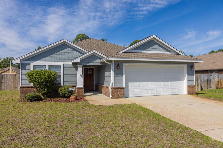 MOVE-IN-READY. Warm, inviting cottage in a charming East Navarre neighborhood.  This three-bedroom two bath home has been NEWLY PAINTED INSIDE AND OUT AND NEW CARPETING AS WELL!  Gourmet kitchen with granite countertops thru out, stainless steal appliance and kitchen and dining with beautiful tile floors. Open floor plan with master suite and bathroom boasting large walk-in closet, trey ceilings with crown molding and garden tub and double sink.  Screened in back porch to enjoy nature at its best and to watch the sun go down. Just minutes away from beaches, shopping Hurlburt Field as well Eglin AFB and much more.  Run don't walk to see this beautiful home........