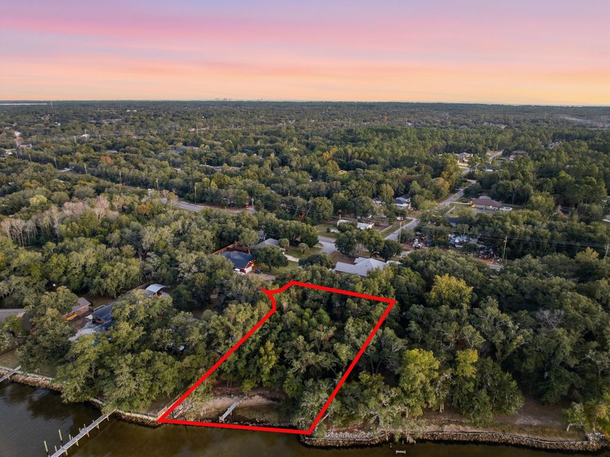 Rare Bayfront Opportunity - Cul-de-Sac Lot with Dock. Discover a rare chance to own a prime bayfront lot with 111 feet of water frontage on a quiet cul-de-Sac. Spanning 0.41 acres, this property offers expansive views, privacy, and direct access to the Bay via an existing private dock--perfect for boating, fishing, or sunset lounging. Whether you're planning a luxury build or securing a long-term investment, this lot delivers unmatched value in a sought-after coastal setting. Highlights: 111 Ft of bayfront on a cul-de-sac, 0.41-acre parcel  Private dock included  Utilities nearby. Lot cleared for easy viewing!