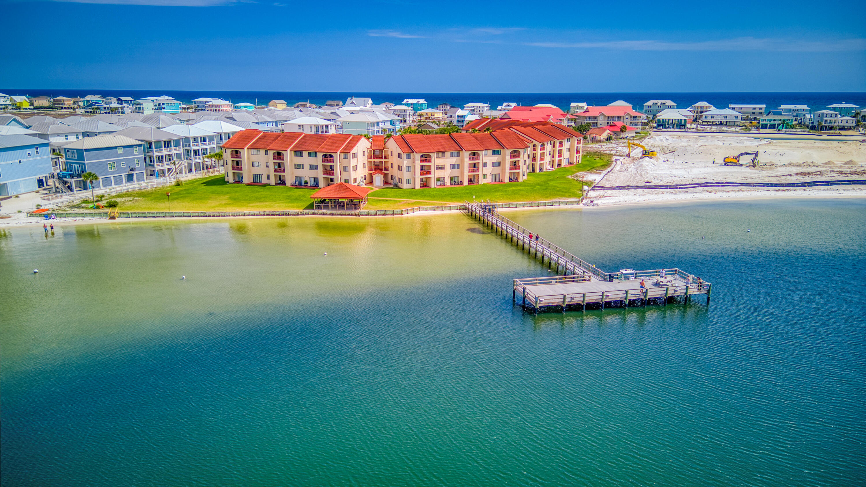 Own your piece of Paradise on Navarre Beach. Elegant and updated turnkey one bedroom one bath at Sunset Harbor. Enjoy sunsets from your covered deck, from the huge community pool or from the private pier on the Santa Rosa Sound. This complex offers everything you need for a beach getaway. Plently of parking, community pool, gazebo for gathering and grilling, pier and sandy Sound beach. Take the stairs or the elevator to this second floor beauty. Updated kitchen with granite countertops, separate dining area, sink into the new sofa's or step outside and relax on the inviting deck. Back inside rest up in the charming bedroom with a view. The bathroom boasts a tiled walk in shower. This unit also comes with a washer and dryer. boasts a tiled walk in shower. This unit also comes with a washer and dryer. Just a short walk to the white sands and emerald green waters of the Gulf. Make this your permanent home or use it as your vacation escape and investment property. Short term rentals are allowed.