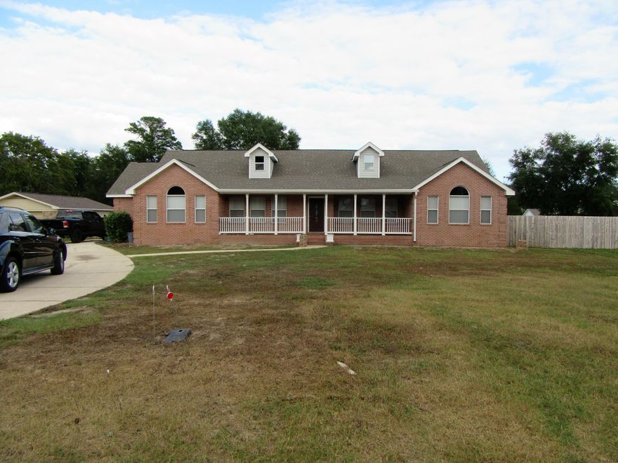 THIS IS A BEAUTIFUL HOME LOCATED ON A LEVEL LOT ALMOST HALF AN ACRE .46. DRIVING UP TO THIS PROPERTY WILL INSTANTLY MAKE YOU FEEL AT HOME WITH ITS SOUTHERN CHARM. YOU PICTURE HAVING A GLASS OF SWEET TEA ON THE VERY LARGE COVERED FRONT PORCH HAVING RELAXING TALKS OR READING A BOOK. UPON ENTERING THE HOME WHICH HAS BEEN COMPLETELY RENOVATED, IT WILL TAKE YOUR BREATH AWAY. LARGE FAMILY ROOM WITH VAULTED CEILING AND FIREPLACE WITH CUSTOM MANTLE AND SKY LIGHTS. IT'S JUST GORGEOUS. IT HAS A VERY LARGE KITCHEN WITH LARGE ISLAND BAR AND COOKTOP. FOR THE HOLIDAYS YOU WILL LOVE THE DOUBLE OVEN FOR THE EXTRA COOKING AND CABINETS GALORE. THIS HOME IS PERFECT FOR ENTERTAINING AND LARGE COOKOUTS AND GET TOGETHERS. A NEW ROOF WAS PUT ON IN 2013,NEW APPLIANCES, NEW JACUZZI TUB, NEW CUSTOM TRAVERTINE TILE