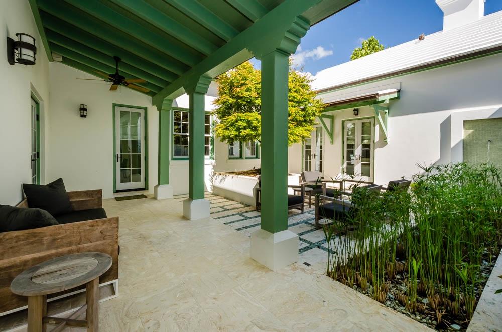 This 3 bedroom, 3.5 bath, 2,584 square foot courtyard home is just a short walk from Fonville Press. The floor plan includes an open kitchen, living area and dining room that open onto a private courtyard with lush landscaping and a soothing fountain. The kitchen is equipped with top-of-the-line stainless steel appliances, limestone countertops and custom red gum cabinets. The master bedroom is separate from the main house and offers a private retreat. A second floor has two spacious bedrooms with private baths. Built to FORTIFIED for Safer Living standards.