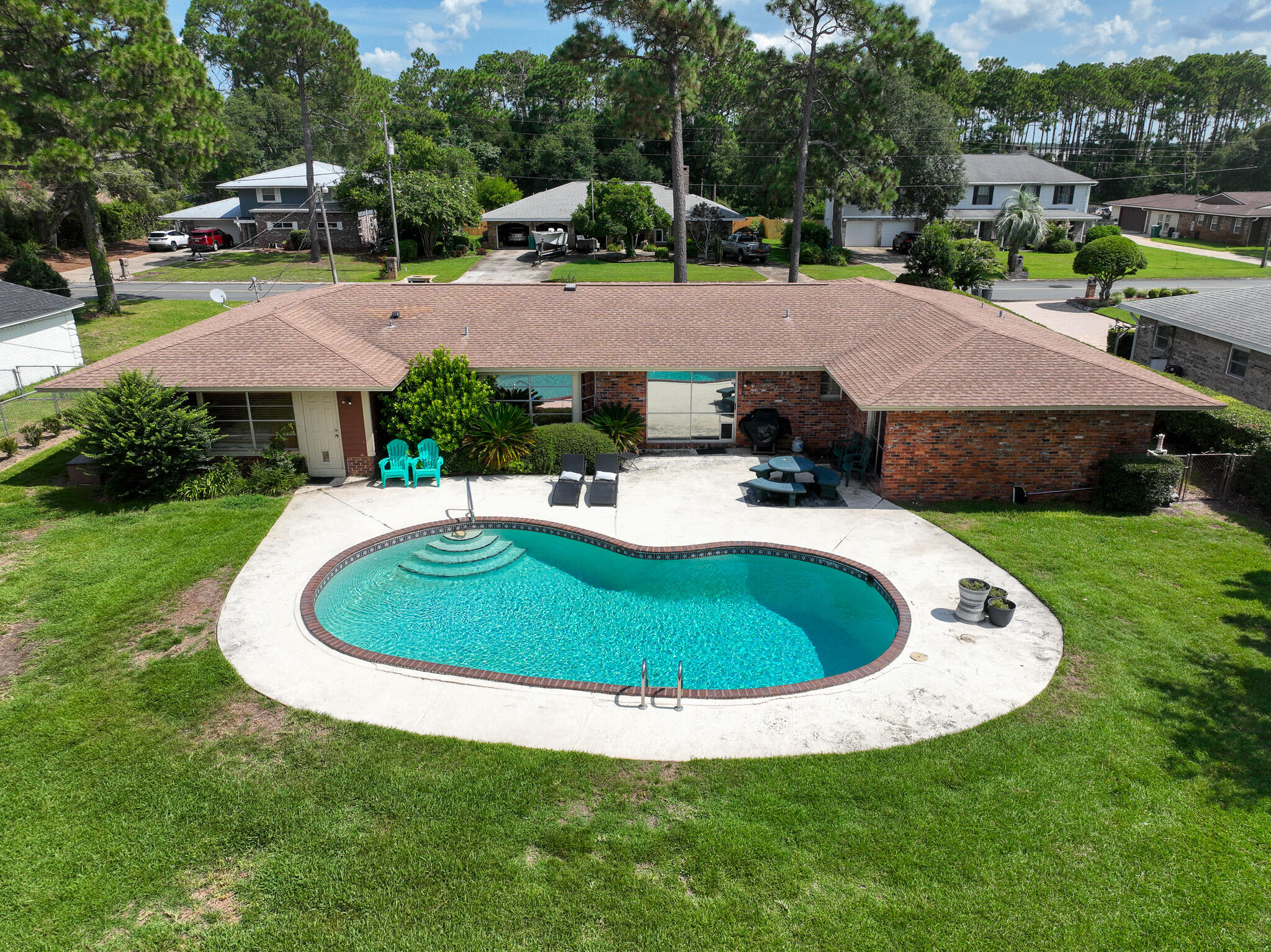 Amazing Neighborhood! Brick 4 Bedroom 2.5 Bath Golf Course Home On Hole #5 Shalimar Point. No H.O.A., Private Pool, Excellent Family Home. Bonus Pool Room, Living Room, Dining Room, Amazing Yard!