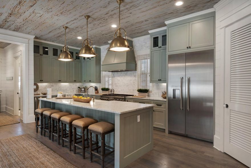 ONE BLOCK FROM THE GULF, this Classy Beach House Sleeps 16 and Sports Luxury Amenities ThroughoutAn expansive beach home with class, this 3-floor beauty presents casual, gracious living with an attractive, open floor plan. Old Seagrove is a desirable address, and a beach house that sleeps 16 may be your next savvy investment or family home. Beamed ceilings of pecky Cypress and white oak floors lend an Old World touch to the contemporary feel. Creamy interior shiplap walls and natural woven rugs set the stage for indulgent entertaining and fabulous beach vacations. Copious natural daylight permeates the home, and a second living and entertainment area boasts its own kitchenette. Thoughtful design features include an elevator, three washers and dryers, garage, top-of-the-line kitchen appliances and Gulf views from a 4th floor tower with wet bar. A generous covered porch features a wonderful, outdoor kitchen near the pool. This luxurious retreat is but steps from the beach and under 3,000 feet to Seaside Town Center. From cool bathrooms and exquisite furnishings to the gourmet kitchen and an adorable, outdoor circular staircase, this home has everything one could want in a spacious beach house. 