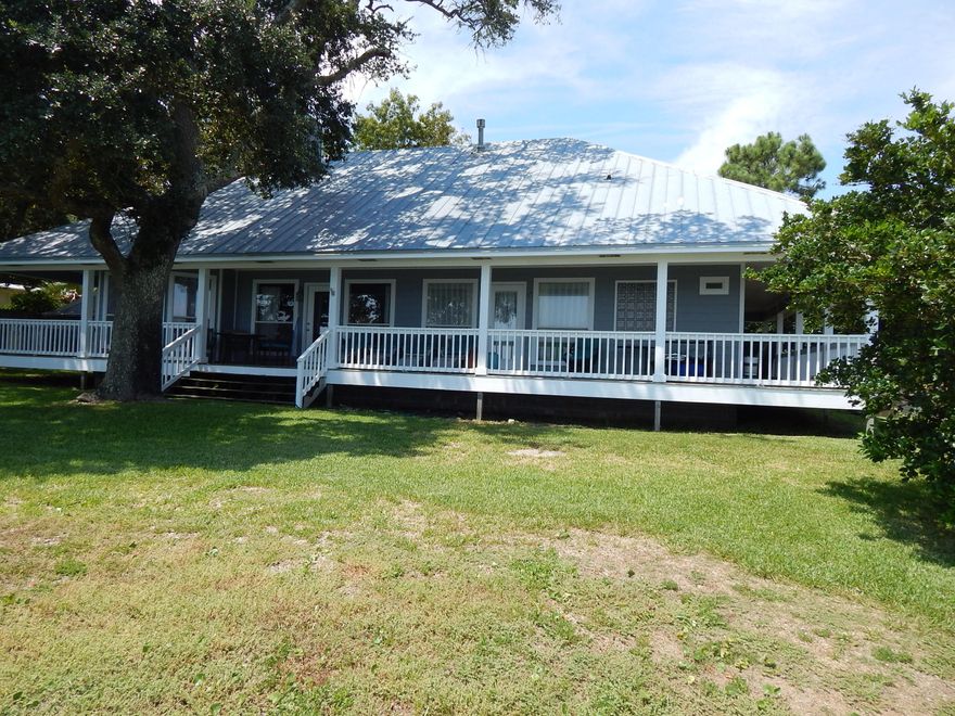 OPPORTUNTY TO OWN INCOME PRODUCING PROPERTY WITH 100FT OF WATERFRONTAGE! This property has a Main Waterfront 3/2 home with 2000sf on the Intracostal Waterway/Santa Rosa Sound PLUS 6 rental cottages! Use the main home as a Primary Residence and take advantage of the multi unit zoning that is in place! The main house has a metal roof and many amenities: Laundry Room with Utility sink; Bright Waterfront Kitchen with Large Pantry, Island/Cooktop, Double Oven, Microwave, abundant cabinets and a breakfast nook; a Formal Dining rm; Large Waterfront Master Bedroom; Master Bath with double vanities; Separate Shower, Garden Tub and Walk-In Closet! The Living Room is Waterfront and opens to the covered porch! The gorgeous covered wrap-around porch extends the entire back and sides,
