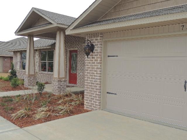 This BEAUTIFUL HOME IS COMPLETE!Beautiful Natches III at 7363 BROADMOOR Street, Navarre, FL in Holley by the Sea. Some of the wonderful features of this beautiful home are** Covered front entry with beveled glass front door, a 4th bedroom has French doors opening to foyer, can also be utilized as office/study. Tile in foyer, kitchen, breakfast nook, and baths. Great Room has vaulted ceilings, display niche, and plant ledges. Fantastic Kitchen with Solid Wood Raised Panel Cabinets, Dishwasher, Self-clean Oven, Smooth Top Range; plus, built-in Microwave Hood. ~Granite Countertops with under mount sinks in kitchen and baths. Vaulted Ceiling in Great Room, 5 1/4'' Base