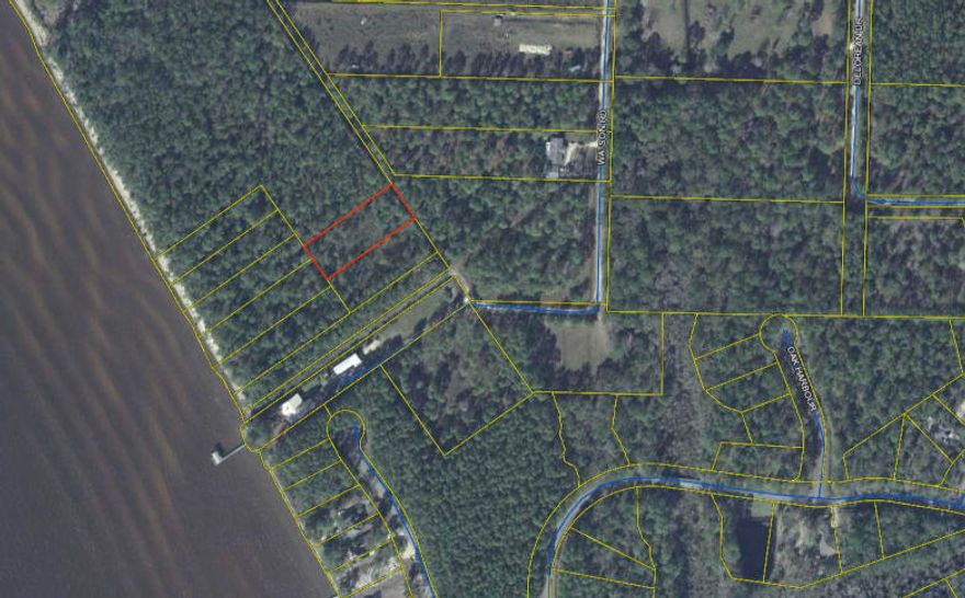 Looking for land by the bay? Check out this large lot that is waiting to be built on.