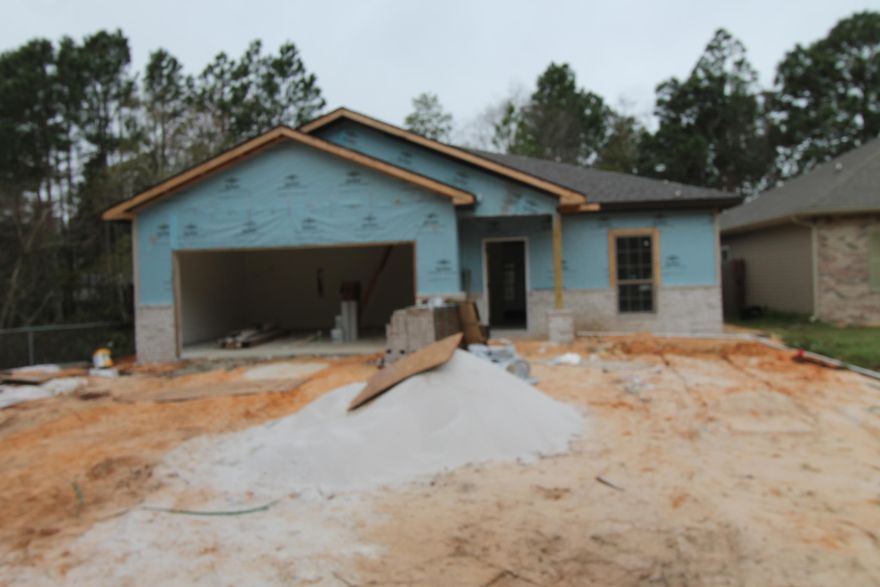 Home is much further along than what picture shows. New, custom, 4/3, ''Craftsman Style'' floor plan, with super curb appeal. Great location!!! Tom Street is on the North side of Hwy 98, just 1 minute past the Santa Rosa County line. 10 Ft. ceilings throughout main living areas, as well as tile flooring throughout main/ wet areas. As you enter the home through the covered porch, bedroom 1 is at the right followed by bath 1. Continuing down the hallway, the kitchen will be on your left which boasts custom painted ivory cabinetry, a breakfast bar, granite countertops, a pantry, and stainless appliances, including a refrigerator/ freezer, with ice maker. At the front of the kitchen is the dining area/ great room combination that opens to a covered porch, perfect for entertaining.