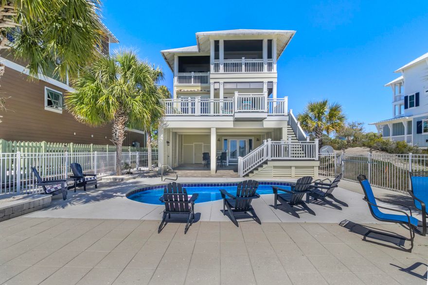 Set on an expansive 1.15-acre gulf-front lot, this extraordinary estate in the gated community of Jubilation offers a level of privacy and coastal luxury rarely found. Thoughtfully designed with breathtaking panoramic gulf views, this five-bedroom, five-bathroom residence spans over 3,200 square feet of refined living space, seamlessly balancing sophistication with comfort. Every bedroom features a private balcony, creating a personal retreat with stunning vistas of the Gulf of Mexico. The heart of the home is a chef's kitchen, meticulously designed with high-end Sub-Zero appliances, a Wolf gas range and custom lighted cabinetry that adds both elegance and functionality. An oversized island with quartz or stone countertops provides ample space for cooking and entertaining, while a dedicated coffee and wet bar includes a 140-bottle wine cooler, ensuring a seamless hosting experience. The open-concept living and dining areas are bathed in natural light, offering unobstructed gulf views through expansive windows. Each of the five bedrooms is generously sized, with private access to gulf-facing balconies that invite the soothing sounds of waves and stunning sunsets into everyday life. The primary suite offers a serene escape with a spa-like ensuite bath, featuring premium finishes and ample storage. Designed for outdoor enjoyment, the property features a private heated pool overlooking the gulf, surrounded by professional landscape lighting that enhances the ambiance after sunset. A private boardwalk leads directly to the sugar-white sands, ensuring effortless access to the beach. The home's exterior has been meticulously maintained, with recent updates including a fresh coat of paint, a newly redone driveway and enhanced landscaping. Located in one of the most exclusive beachfront communities, this estate offers an unparalleled coastal lifestyle. The gated setting ensures security and seclusion while still providing easy access to the area's renowned dining, shopping and outdoor recreation. Whether as a primary residence, a luxurious second home or a high-end vacation rental, this property presents a rare opportunity to own a piece of paradise on the gulf.