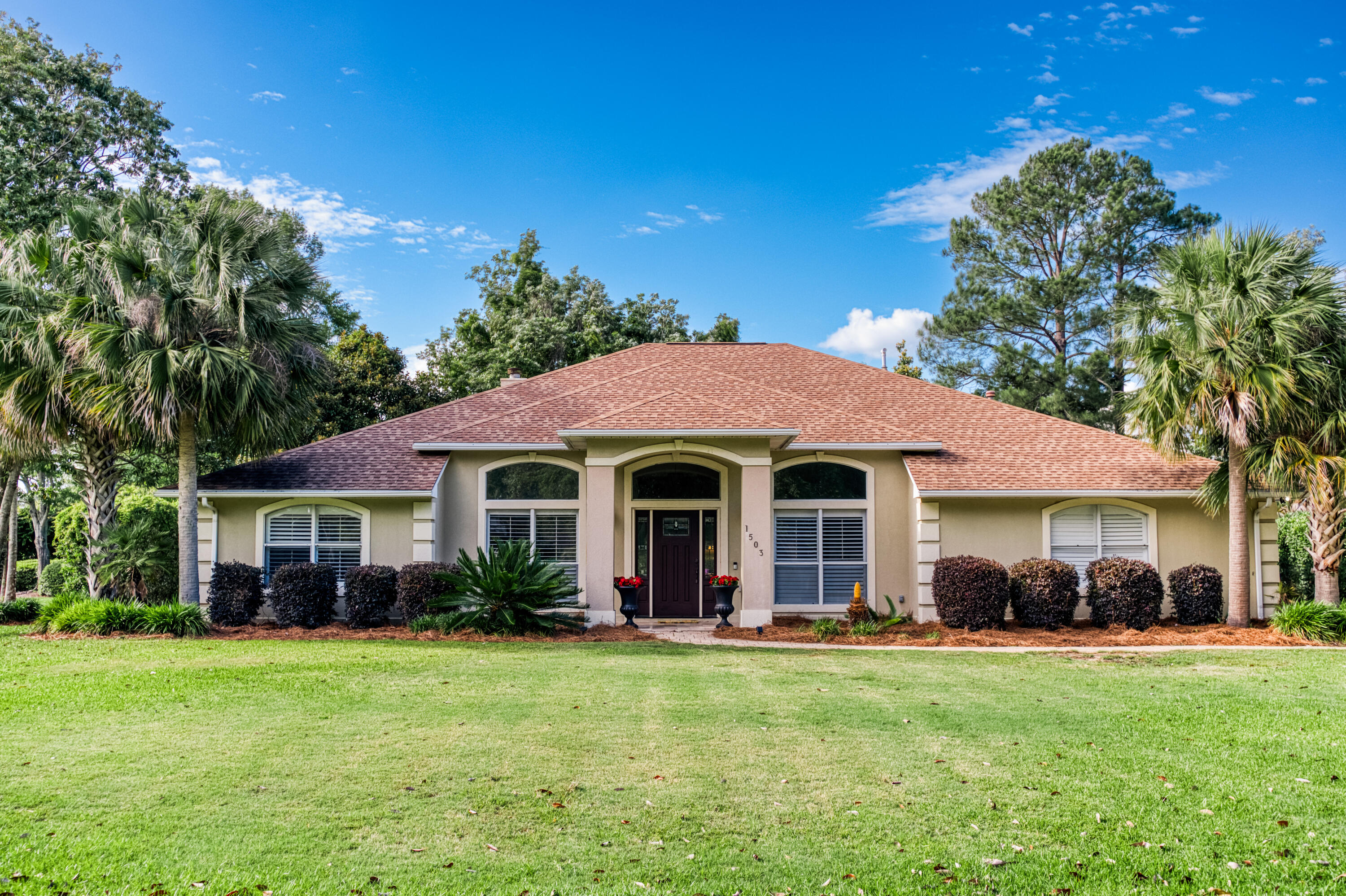 Welcome to 1503 Glenlake Circle, nestled in the highly sought-after Glenlake neighborhood of Bluewater Bay. Situated on a large oversized corner lot, this lovely home offers four spacious bedrooms and three full baths in a thoughtfully designed split floor plan.Inside, you'll find a dedicated study, an elegant formal dining room, and an open-concept living area that flows seamlessly--perfect for both entertaining and everyday living. Tasteful updates throughout enhance the home's charm and functionality.Step outside to your freshly screened lanai and large pool--an ideal retreat for enjoying Florida's year-round sunshine and outdoor lifestyle! Conveniently located near award winning schools, great dining, and the beautiful Emerald Coast...don't miss the opportunity to make it yours!