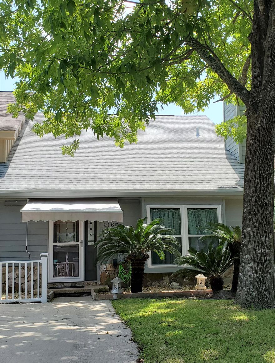 This is a lovely townhome with master bedroom 1st floor. Stone Fireplace in Living room w/mantel. Also a large box window. New front entry door w/sidelite.  Nice cabinets, Glass sliding door in kitchen, overlooks the lily-pad pond. Chain link fence on property in back yard, goes almost to the water. Brick type patio. Glass sliding door in Master Bedroom that overlooks the pond & patio. Glass sliding door. New roof , Master Bath shower in 2019.  Replaced all the windows,  water heater, granite counter tops and floors in 2018.