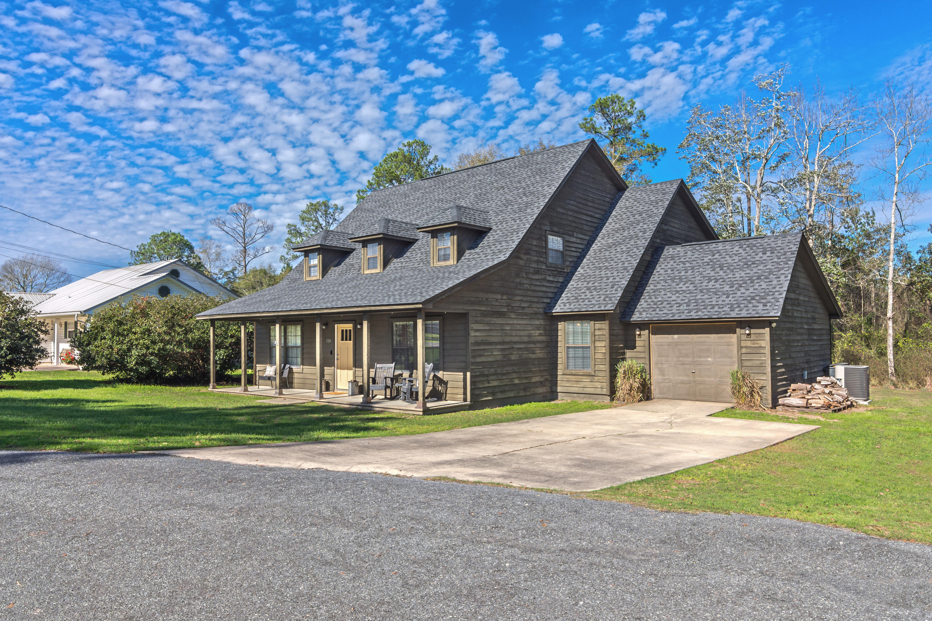 LOCATED IN THE NORTH END OF WALTON COUNTY ON A QUIET CUL DE SAC WITH EASY ACCESS TO EVERYTHING - THIS 5 BEDROOM HOME HAS TONS OF OPTIONS TO OFFER IN A HOME. JUST BLOCKS FROM THE SCHOOL, THIS HOME HAS BEEN WELL MAINTAINED AND IS IN MOVE IN READY CONDITION WITH ALL NEW FLOORING, NEW PAINT, AND A NEW ROOF. HOME HAS A LARGE LIVING ROOM WITH WOOD FIREPLACE, GREAT DINING ROOM FOR FAMILY FUNCTIONS AND SITS ON A LARGE ACRE LOT WITH A GREAT BACK YARD AND OPEN DECK. MASTERS ARE AVAILABLE ON BOTH FLOORS OF HOME WITH PRIMARY LOCATED ON BOTTOM.HOME IS CURRENTLY USED AS A 5 BR BUT HAS ROOM FOR A 6TH OR IF YOU DON'T NEED THAT MUCH ROOM YOU CAN HAVE 4 BR, A OFFICE, AND 2 LIVING ROOMS. HAVE A LARGE FAMILY - THIS HOME HAS HOSTED COUNTLESS FAMILY GATHERINGS AND IS READY FOR A NEW FAMILY. CALL TODAY!