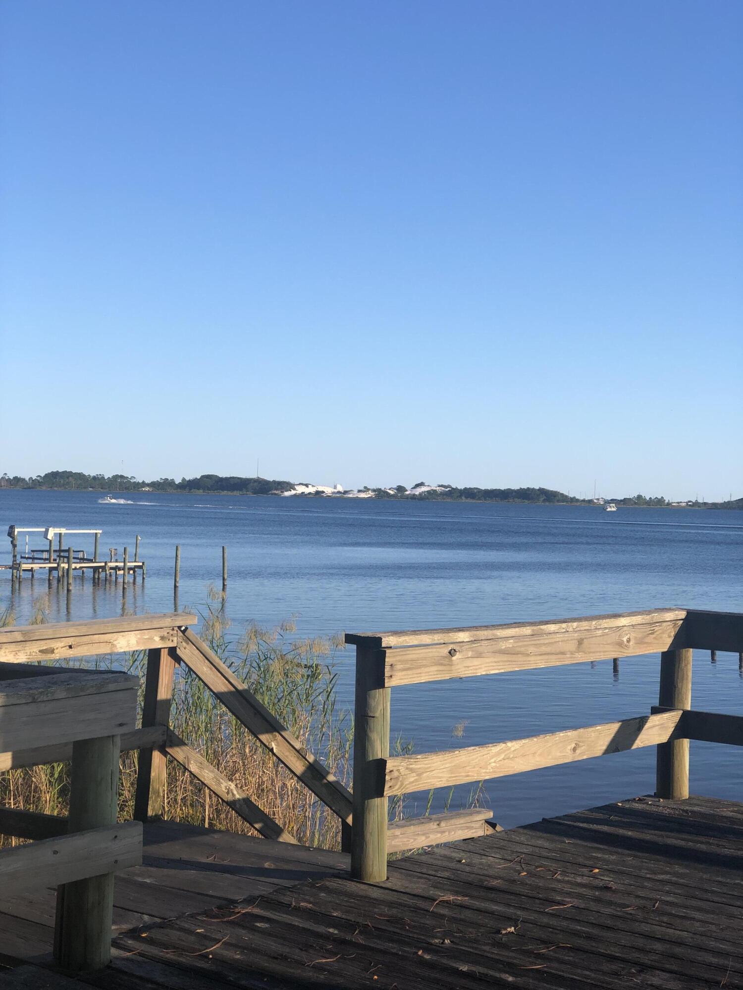 WATERFRONT OPPORTUNITY!!! With a little love and care this is the perfect fixer upper to be your million dollar property!!! This could be a flip, a vacation home or your forever home - so many possibilities. Beautiful views of the Santa Rosa Sound from practically every room. The floor plan includes a formal living room, family room, large kitchen and dining area. The kitchen has a huge island and built in china cabinet, desk and bar area. There's 3 beds/2 baths to the left and then 2 beds/1 bath to the right that could be an excellent lock out apartment if needed. The main bed/bath includes a double vanity, walk in closet and door to the backyard. Out back enjoy the Florida Room or deck. There's also a 3 car garage and 2 sheds up front. Get your boat and paddle boards ready now!