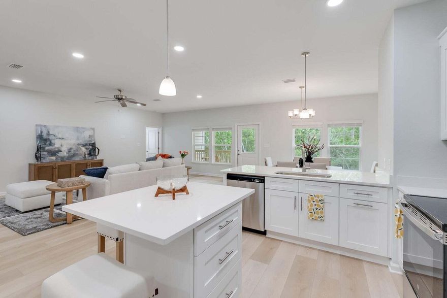 Experience the pinnacle of coastal living in the newly completed custom home within the sought-after Riverwalk community. This exquisite residence offers a generous $10,000 closing cost credit when using our preferred lender and title services, plus the inclusion of a refrigerator and blinds. Secure your contract before February 31st to receive a complimentary upgrade. Furnishing package available.Spanning 1,850 square feet, this home features a thoughtfully designed open floor plan that promotes seamless living. The kitchen is a chef's dream, boasting quartz countertops, elegant white shaker cabinets, luxury vinyl plank flooring, and top-of-the-line stainless steel appliances. The home's superior craftsmanship is evident in its upgraded trim package, ensuring a blend of quality and style throughout.