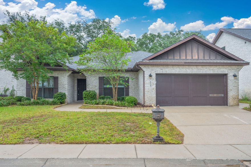 Beautifully maintained four-bedroom, two-and-a-half-bath, single-story brick home in the heart of Destin. From the moment you step through the attractive entryway with upgraded lighting, you'll appreciate the open floor plan, tall ceilings, and wood-look tile flooring throughout the main living areas. The kitchen features stainless steel appliances and a built-in bar or buffet, perfect for entertaining. A dedicated dining space adds functionality and charm.The split floor plan offers privacy, with the spacious master suite boasting tray ceilings, a large window, an expansive dual-sink vanity, custom-tiled shower, and a generous walk-in closet. Guest bedrooms share a stylish bathroom with a double vanity and tiled shower/tub combo. Every room is equipped with ceiling fans for comfort, and a separate powder room adds convenience for guests. Additional highlights include a large laundry room, a two-car garage, and a fully fenced-in backyard with zero-scape landscapingcompletely no-maintenance and ideal for low-effort outdoor enjoyment.