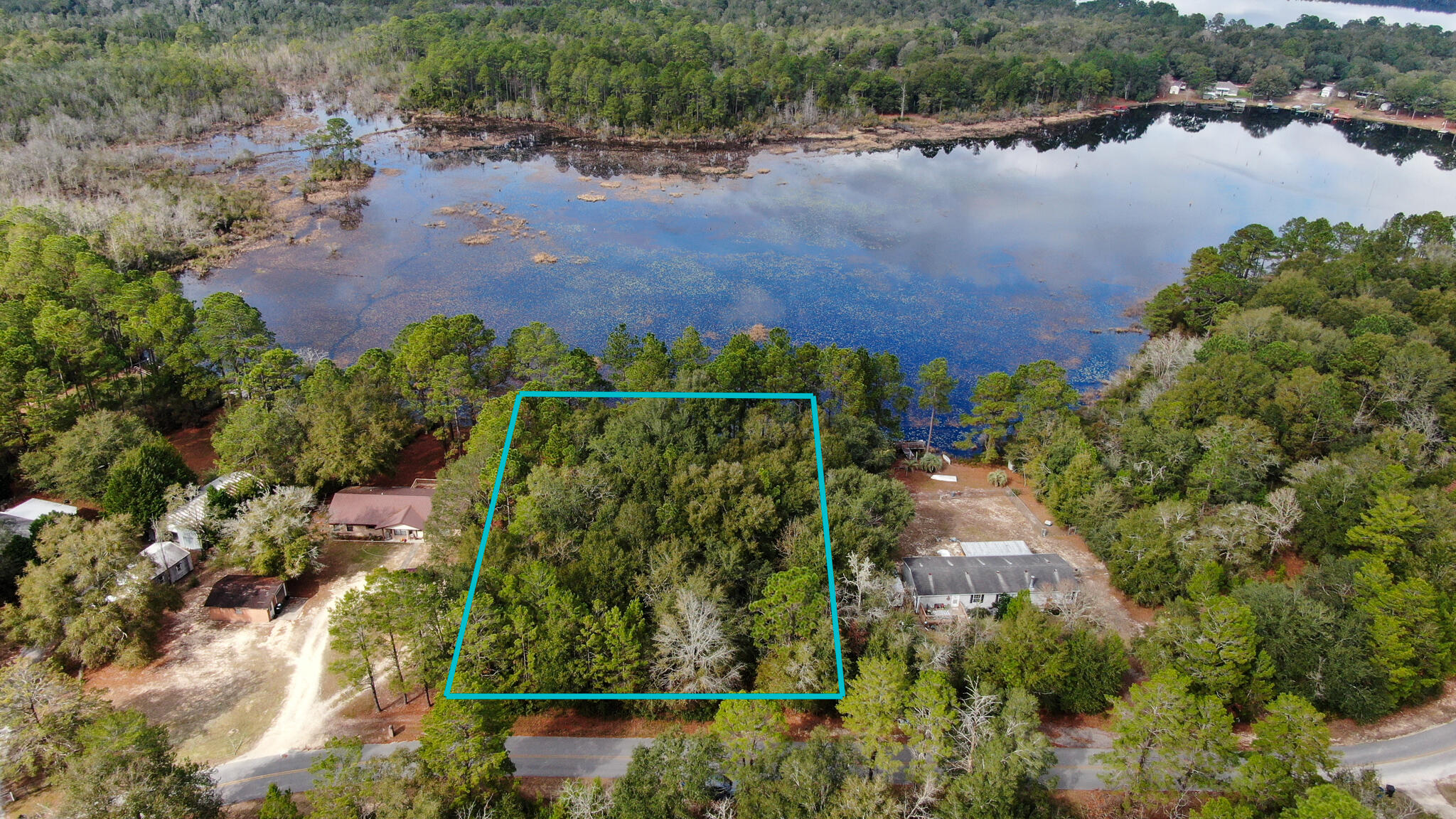 Nice size .77 Acre lot on Lake Juniper. Build your lake home here to enjoy picturesque mornings and evenings looking out over the lake.